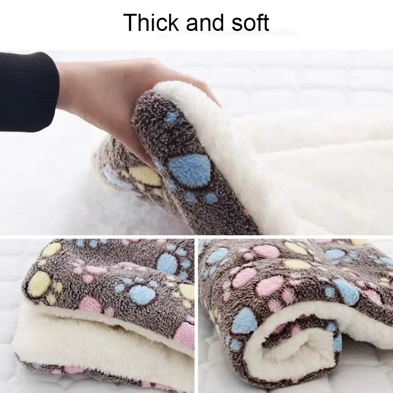 Thick and soft coral velvet pet sleeping mat with colorful paw prints, ideal for cozy pet bedding.