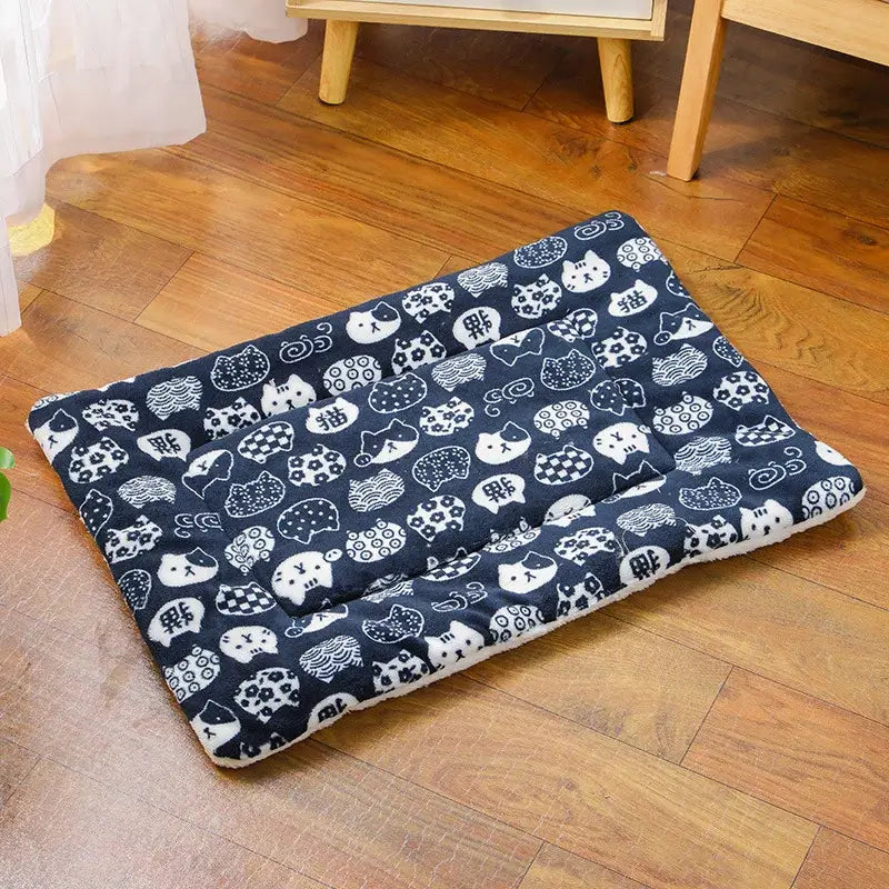 Cozy Paw-some flannel pet sleeping mat with a stylish print, perfect for pets. Comfortable non-slip design for all sizes.