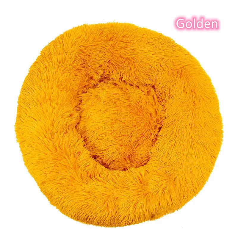 Golden round plush dog donut bed, ideal for cozy naps, calming for pets, perfect for small dogs and cats.