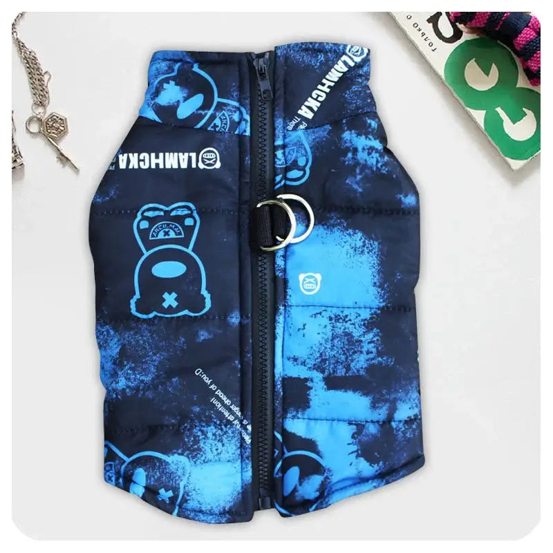 Waterproof dog jacket with harness in blue camouflage design, featuring a durable zipper and traction buckle for all-weather protection.
