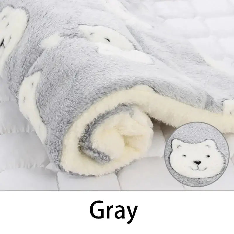Cozy gray flannel pet mat with cute bear print, perfect for keeping pets warm and comfortable.