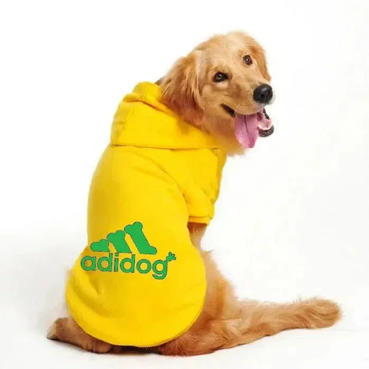 Happy dog wearing a yellow Adidog Hooded Sweatshirt, showcasing a stylish and cozy pet outfit for autumn and winter.