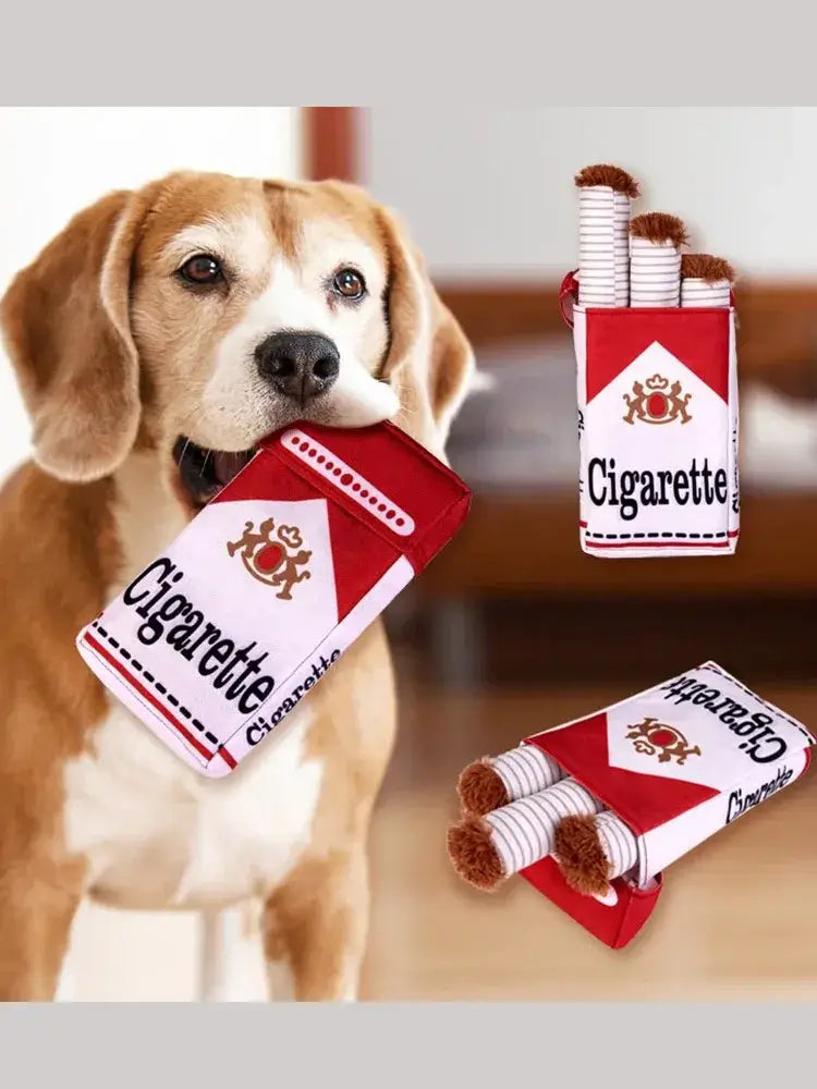 Beagle puppy holding a plush cigarette box dog toy set with squeaky cigarette toys for fun playtime.