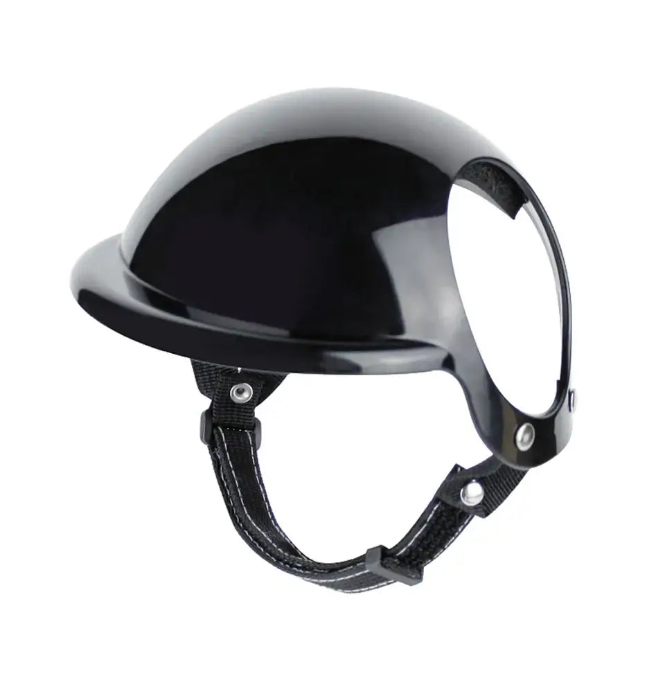 Black pet motorcycle helmet with adjustable straps for dog and cat safety during outdoor adventures.