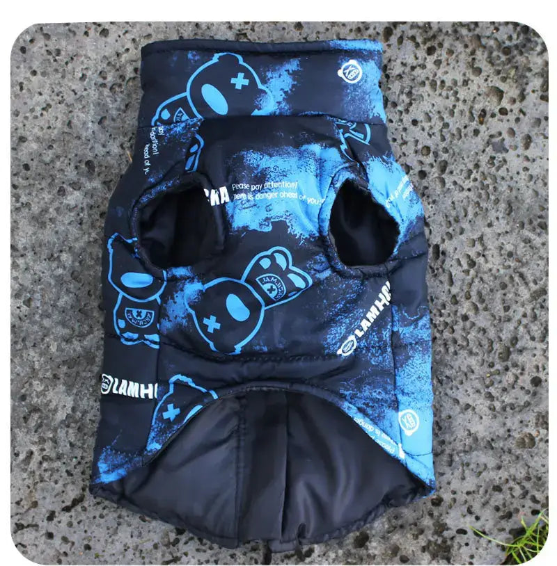 Stylish waterproof dog jacket with harness in blue camouflage design, perfect for all-weather protection.