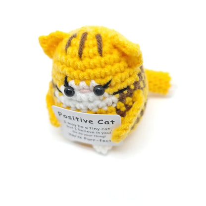 Handmade crochet cat doll with positive message, perfect for home decor or as a gift.