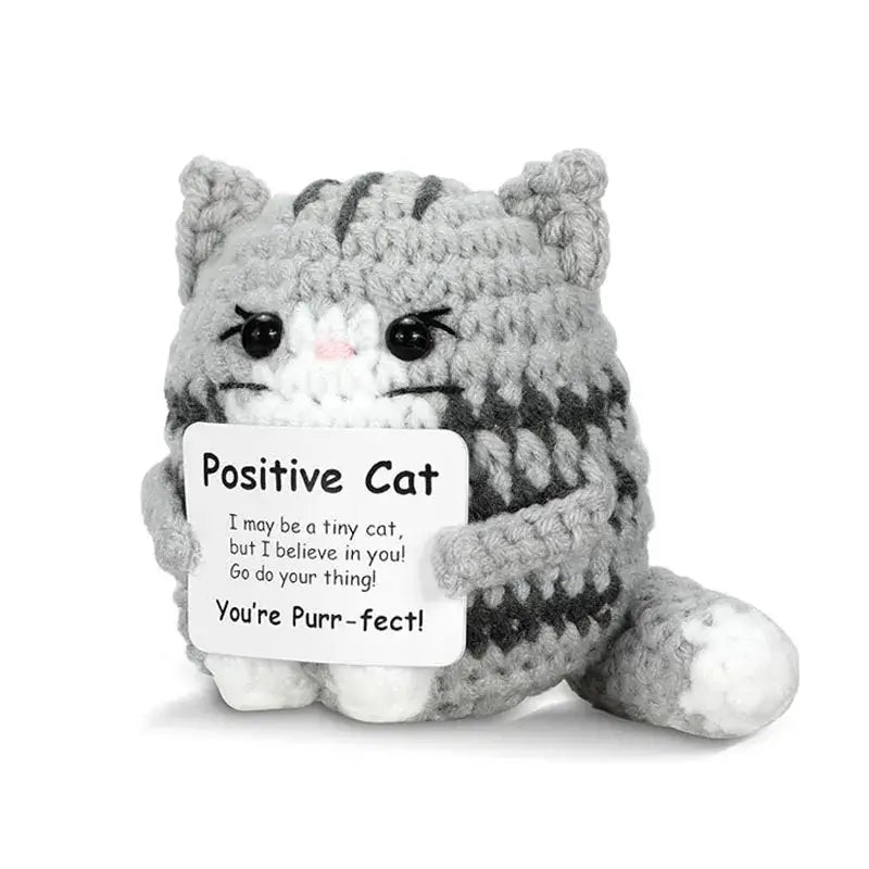 Handmade crochet cat ornament doll with a positive message, perfect for home decor or gifts.