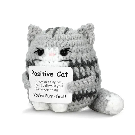 Handmade crochet cat ornament doll with a positive message, perfect for home decor or gifts.