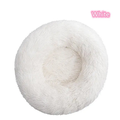 White round fluffy pet bed for cats and small dogs, ideal for calming and anxiety relief.