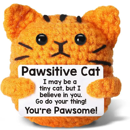 Handmade crochet orange cat doll holding a sign with motivational message 'You're Pawsome!' perfect for home decor.