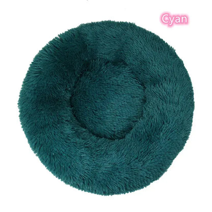 Cyan round plush dog bed, offering comfort and support for small dogs and cats, perfect for cozy naps.
